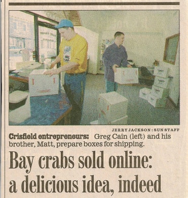 Baltimore Sun newspaper clipping from 2001 headlined Bay crabs sold online: a delicious idea, indeed, showing Greg and Matt Cain packing shipping boxes in Crisfield