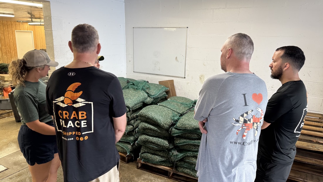 Pallets of mesh grow-out bags stacked in the warehouse at the Cape Charles shellfish farm