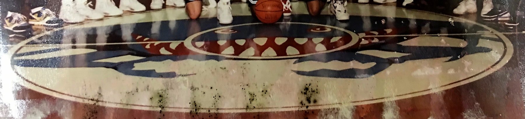 The snarling crab logo painted at center court of the Crisfield High gym floor.
